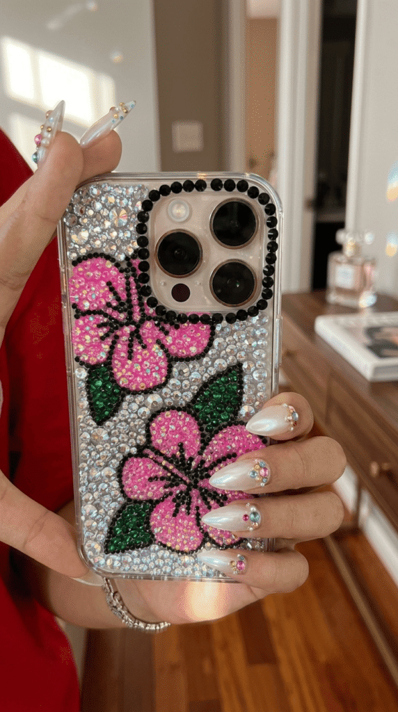 clear phone case decorated with rhinestones in a DIY bedazzling