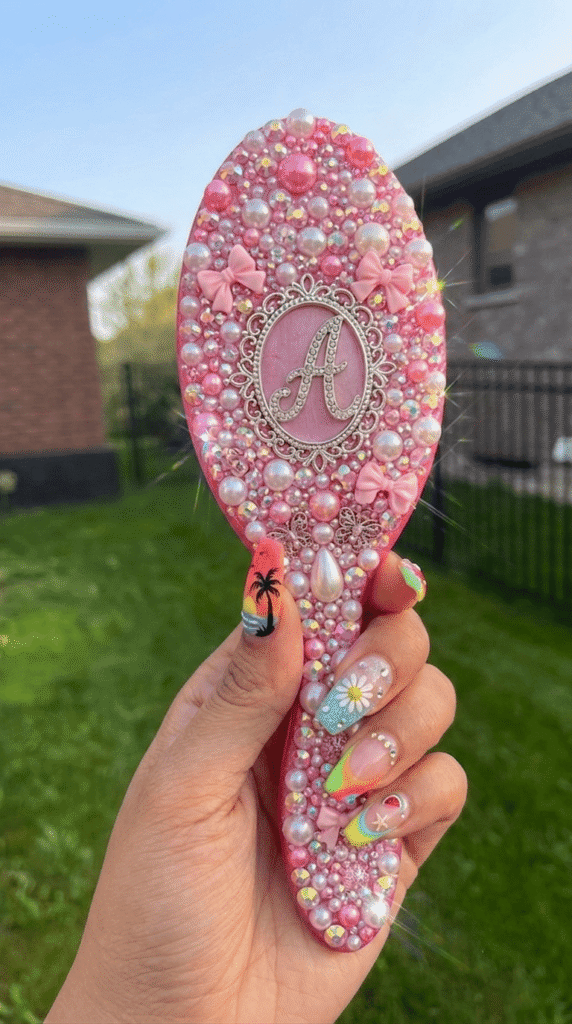 hairbrush handle covered in rhinestones as a DIY bedazzling 