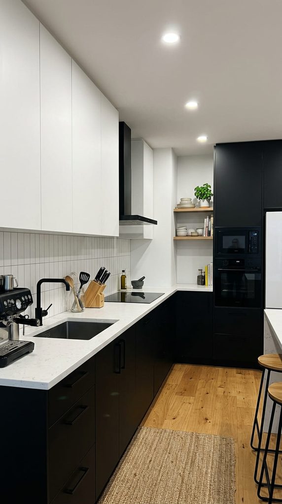 Two-tone kitchen cabinets with black lower cabinets and white upper cabinets