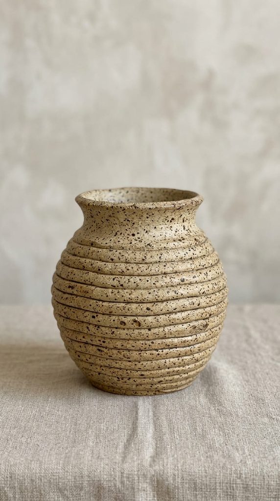 Coil pot made with speckled stoneware clay showing natural flecks